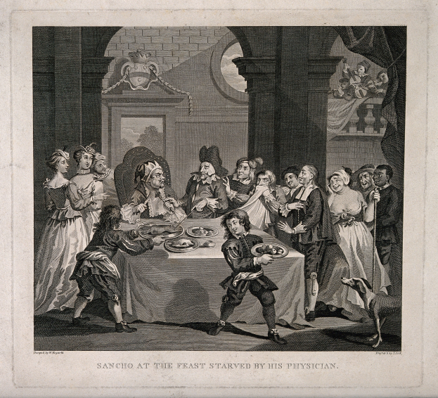 Eine Gruppe von Menschen sitzt an einem Tisch mit Tellern voller Essen, ein Foto Rahmen an der Wand im Hintergrund und Text unten mit der Aufschrift "Sancho beim Fest vom Arzt verhungert".